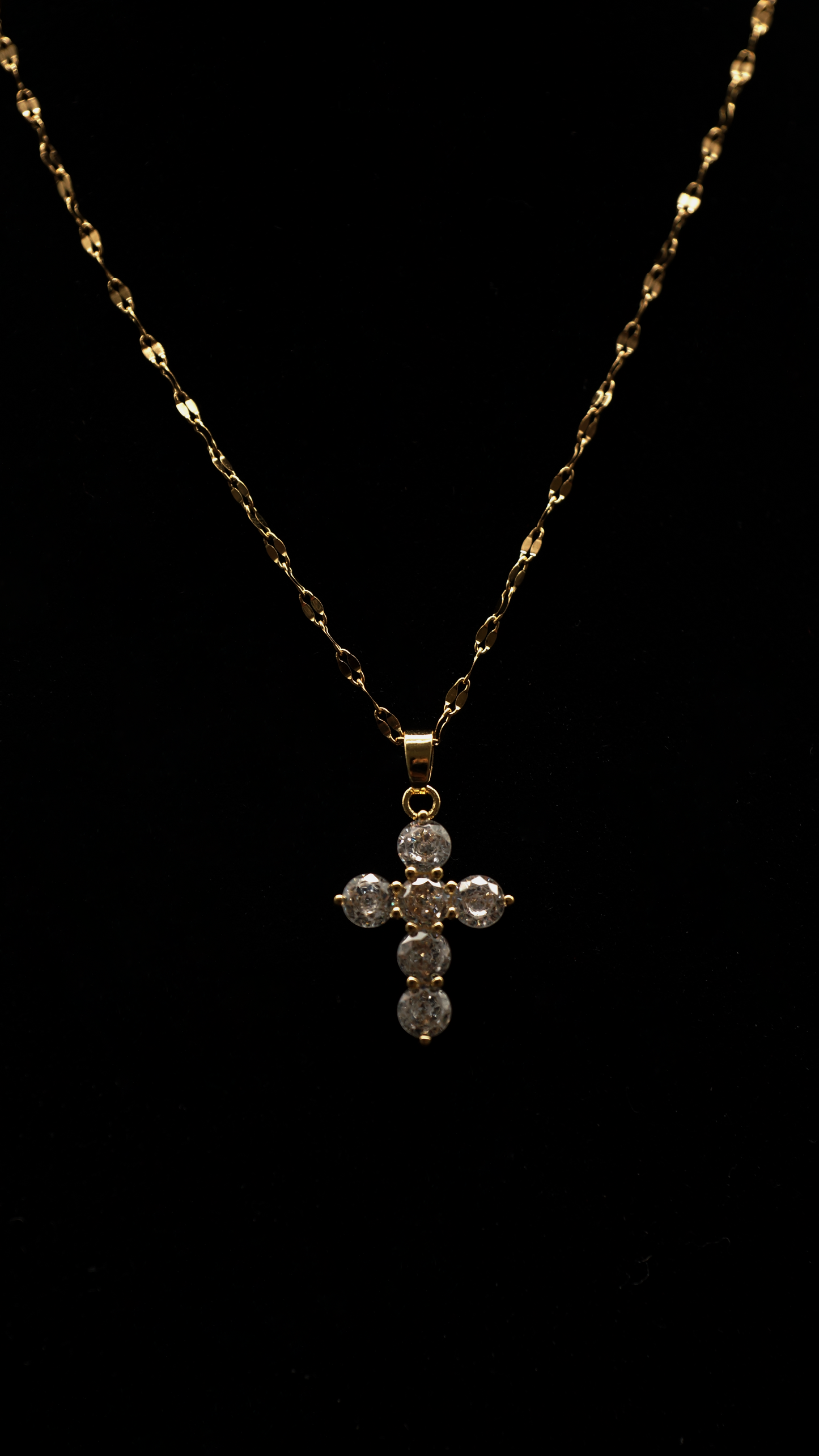 Kreuzkette runde Steine / gold